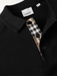 Burberry updates the classic polo shirt with an embroidered tonal monogram at the chest and its iconic check along the placket. This version is cut from cotton-piqué and detailed with herringbone stiches along the collar. Burberry Collection, Burberry Polo Shirt, Types Of Suits, Polo Fashion, Burberry Logo, Burberry Shirt, Polo Shirt Design, Polo Logo, Pique Polo Shirt