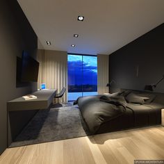 a large bed sitting in a bedroom next to a tv mounted on top of a wall