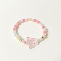 "Pretty Little Summer - The Paisley Bracelet 24k gold 3mm beads, Pink Glass Butterfly, Multicolor Seed Beads (shades of pink, cream, and light green) Recommended Sizing: Measure your wrist, and add 1/2\" Infant (<1 yr): 4.5\" Toddler (1-3 yrs): 5\" Child XS (3-5 yrs): 5.25\" Child S (5-7 yrs): 5.5\" Child M (8-10 yrs): 6\" Child L (10-12 yrs): 6.25\" Adult XS: 6.5\" Adult S: 6.75\" Adult M: 7\" Adult L: 7.25\" Adult XL: 7.5\"" Pink Tiny Beads Bracelets For Spring, Pink Crystal Bracelet With Colorful Beads For Friendship, Pastel Beaded Stretch Bracelet As Gift, Casual Pastel Beaded Jewelry, Pastel Beaded Stretch Bracelet Gift, Pink Resizable Bracelet For The Beach, Pastel Beaded Stretch Bracelet, Whimsical Pink Adjustable Bracelets, Playful Pink Adjustable Bracelets