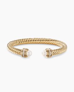 David Yurman’s artistic signature, Cable began as a bracelet that he hand-twisted from 50 feet of wire. For the past 30 years, he has evolved the twisted helix into a myriad of designs. 18-karat yellow gold Cultured freshwater pearls, 7.75-8mm Pavé diamonds, 0.41 total carat weight Bracelet, 7mm Cablespira® is a patented DY construction that is highly flexible and exceptionally comfortable to wear."} David Yurman Classic Cablespira Bracelet in 18K Yellow Gold with Pearls and Diamonds, 7mm | Wome Luxury Fine Jewelry Bracelets With Polished Finish, David Yurmam Stacked Bracelets, David Yurman Gold Bracelet Stack, Artistic Signature, Yurman Bracelet, Gold Bracelets Stacked, Summer Wishlist, Latest Bracelets, David Yurman Bracelet