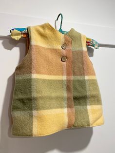 Super cute child's vest , size 5 or 6 Perfect for extra layer of warmth ,while allowing freedom of movement to play and explore. Very handy to layer up or down in Fall/ Autumn / Spring /Winter weather.  This super cute vest is made with a delightful vintage fabric outer featuring nuetral brown and sage green check pattern pure wool  blanket with a plain cotton inner. You can reverse this jacket if you wish. Keep cosy with two buttons at chest to secure .Straight back and front hem. Sleeveless ve Cute Vest, Woollen Blankets, Kids Vest, Vest Pattern, Wool Vest, Vest Outfits, Winter Weather, Vintage Fabrics, Daughter Love