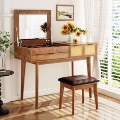 a wooden vanity with sunflowers on it and a stool in front of the mirror