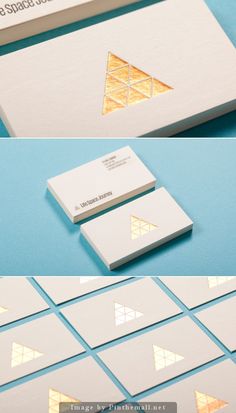 some business cards with gold foil on them