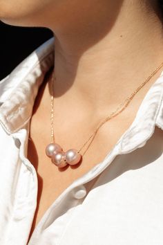 *Limited Edition* An unfailing new classic. This Triple Edison Floating Pearl Necklace is a steadfast companion. Seemingly plucked straight from the ocean, three near round pink pearls flutter along a delicate gold filled chain. This piece is striking solo or makes a bold statement layered with with a bevy of other beauties.✦ CHOOSE YOUR ADJUSTABLE LENGTH ✦✦ DETAILS ✦✧ Name: Lokelani (LOE keh LAH nee) - heavenly rose.✧ Three Large 12mm-13mm Natural Mauve Edison Pearl✧ Color will vary slightly. ✧ Formal Pink Pearl Necklace With Pearl Charm, Elegant Pink Pearl Drop Necklace, Pink Pearl Charm Necklace For Formal Occasions, Elegant Pink Pearl Necklace With Pendant, Formal Pink Pearl Charm Necklace, Classic Pink Akoya Pearl Jewelry, Formal Pink Akoya Pearl Necklace, Formal Pink High Luster Necklace, Elegant Akoya Pearl Pink Jewelry