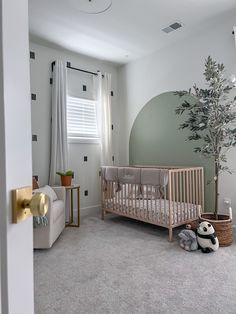 a baby's room is decorated in neutral colors