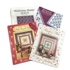 three books about home quilts are on display