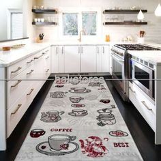 a kitchen area rug with coffee cups and saucers printed on the floor next to an oven