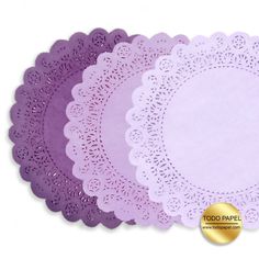 purple paper doilies are arranged on top of each other