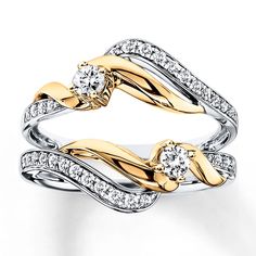 two tone gold and silver wedding ring set with diamonds on each band, in the shape of leaves