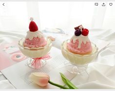 two small desserts sitting on top of a table