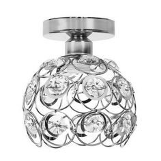 a chrome ceiling light with crystal balls on the top and an open glass shade over it