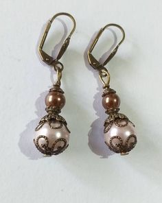 Victorian rose pearl bronze earrings bohemian earrings Boho pearl earrings vintage earrings antique earrings gift earrings wedding earrings Beautiful Victorian style earrings made of crystal rose and brown pearls beads and bronze-tone filigree ornaments . Victorian filigree earrings .  Bronze beautiful Boho earrings. Bohemian earrings . Victorian style bronze-tone rose and brown crystal pearl beads dangle earrings and necklace . Romantic jewelry set pearls earrings . Bridal jewelry set. Wedding Vintage Brown Beaded Earrings As Gift, Vintage Brown Beaded Earrings For Gift, Elegant Bronze Beaded Earrings For Gift, Elegant Bronze Copper Earrings, Elegant Bronze Copper Jewelry, Vintage Beaded Bronze Earrings, Vintage Bronze Beaded Earrings, Handmade Elegant Bronze Beaded Earrings, Elegant Bronze Dangle Earrings