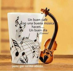 a coffee cup with music notes on it and a violin in the bottom right corner