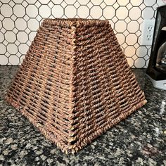 a brown basket sitting on top of a counter