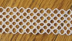 white crocheted lace on wooden table