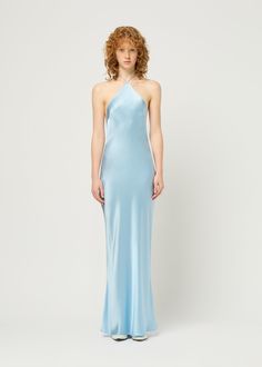 Our effortless Halter Neck Dress features a diamond-pointed neckline, low back and delicate rouleau strap. Maxi in length, the bias cut allows the dress to skim the body. Model is size AU 8 and wearing size small. Baby Blue Silk Halter Dress, Powder Blue Formal Dress, Halter Silk Dress, Halter Neck Dresses, Halter Neck Prom Dress, Powder Blue Dress, Blue Halter Dress, Silk Halter Dress, Blue Halter Top