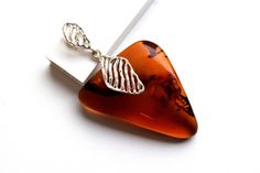 Enjoy Great Opening Prices Genuine natural amber pendant with 925 sterling silver. All of our products are created from genuine natural Baltic Amber. Perfect as a special gift for someone you care about or to wear yourself as a means of expressing your individuality and identity. Comes ready in a Gift Box. Amber is popular as it has marvelous metaphysical properties for psychic protection. It is a powerful healer that gives the person who wears it a lovely sense of health and healing. Amber help Silver Baltic Amber Jewelry As Gift, Silver Baltic Amber Jewelry For Gift, Polished Amber Jewelry For Gift, Amber Jewelry With Polished Finish As Gift, Handmade Baltic Amber Jewelry For Gifts, Handmade Baltic Amber Jewelry Gift, Amber Polished Finish Jewelry For Gifts, Brown Hallmarked Jewelry As Gift, Brown Hallmarked Jewelry Gift