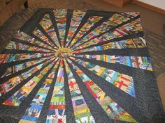 a quilted table topper with many different designs on it