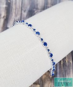 ❤Shop with us online at - https://SomethingIvy.com/❤ Something Blue Bracelet - Sapphire Blue Bracelet - Silver/Blue Bracelets - Wedding Bracelet - Royal Blue Crystal Bracelet Matching necklace - https://www.etsy.com/listing/785385383/fast-ship-sapphire-blue-necklace-royal Matching Earrings available for all bracelet colors, see the earrings section Sign up for promotions here - https://somethingivy.com/pages/promo-sign-up Lovely bracelet, available in Bulk for Bridesmaids Orders or Pageants, ple Royal Blue And Silver Jewelry, Silver And Blue Bracelet, Elegant Adjustable Blue Crystal Bracelet, Adjustable Sapphire Bracelets For Wedding, Blue Bangle Bracelets For Wedding, Blue Bangle Bracelet For Wedding, Adjustable Blue Bracelet For Formal Occasions, Blue Jubilee Bracelet Jewelry For Wedding, Adjustable Blue Crystal Bracelet For Wedding