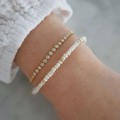 Add a special touch to your look. Our Birthstone Bead Collection styles are crafted with natural stones and three 14k gold rondelles strung on a coated wire for maximum durability. Wear your own birthstone—or a loved one’s—for a meaningful layer in any bracelet stack. Pearl is June's birthstone. Stackable Rondelle Beaded Bracelets, Elegant 14k Gold Filled Rondelle Jewelry, 14k Yellow Gold Filled Birthstone Bracelets, Elegant Gold Bracelet With Spacer Beads For Gift, Dainty Stackable Rondelle Bracelets, Elegant Stackable Beaded Bracelets In 14k Gold, Elegant Everyday Gold Bracelet With Birthstone, Delicate Round Beaded Bracelets For Everyday, Dainty Rondelle Beaded Bracelets For Everyday