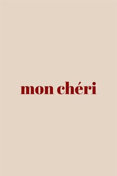 the word mon cher in red on a beige background