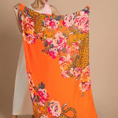 Bold style meets exotic allure in a stunning accessory that commands attention. This luxurious scarf features a striking design of a majestic leopard climbing amidst vibrant tangerine hues, accentuated by oversized pink flowers that add a touch of femininity and flair.

Crafted from premium-quality fabric, this scarf boasts a generous size that allows for versatile styling options. Whether draped elegantly around your shoulders, tied as a statement piece around your neck, or worn as a chic headwrap, the Climbing Leopard Tangerine Scarf with Big Pink Flowers adds an instant touch of sophistication to any ensemble. Summer Florals, Scarf Summer, Leopard Scarf, Printed Scarf, Leopards, Scarf Pattern, Summer Floral, In Bloom, Bold Fashion