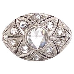 Circa: 1890s Metal Type: Platinum and 14K White Gold Size: US 6.75 Weight: 4.2g Diamond Details: Cut: Rose cut Carat: Center is approximately 0.50 carats, total diamond weight 0.75 carat total weight Color: K-L Clarity: VS-I1 Antique Sapphire Engagement Rings, Vintage Sapphire Engagement Rings, Rose Cut Ring, Sapphire Engagement Rings, Rosecut Diamond Ring, Diamond Flower, Sapphire Engagement, Rose Cut Diamond, Engagement Rings Sapphire