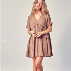 Mauve/Tan Textured Dress With Beautiful Detailing Brown V-neck Mini Dress For Spring, Khaki Short Sleeve Summer Dress, Brown V-neck Mini Dress For Day Out, Neutral Short Sleeve Midi Dress For Beach, Beige Short Sleeve Summer Mini Dress, Spring Taupe V-neck Dress, Summer Neutral Short Sleeve Dresses, Summer Khaki Mini Dresses, Khaki Mini Summer Dresses