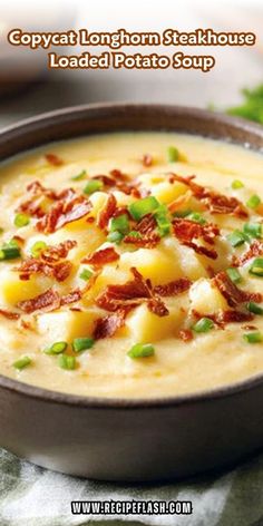 a bowl of potato soup with bacon and green onions