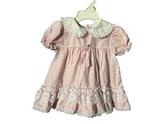 Vintage pink frilly baby dress, tag says Alexis, sz 9 mos, 65% polyester 35% cotton. Dress buttons in the back, white lace trim. Dress is in great condition. Cotton Baptism Dress With Lining, Cute Fitted Ruffled Vintage Dress, Cute Fitted Vintage Dress With Ruffles, Summer Vintage Dress With Ruffles For Dress-up, Summer Dresses With Lace Trim And Peter Pan Collar, Cute Summer Vintage Dress With Lace Trim, Pink Doll Collar Dress For Spring, Cute Vintage Dress With Lace Trim For Summer, Cute Vintage Summer Dress With Lace Trim