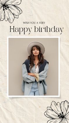 a woman wearing a hat is standing in front of a card with the words, wish you a very happy birthday