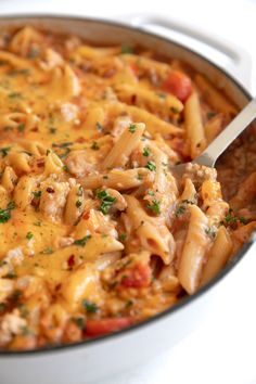 a large pot filled with pasta and meat