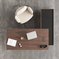 an overhead view of a desk and chair