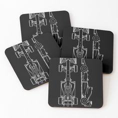 four black and white coasters with drawings of cars on them, all in different sizes