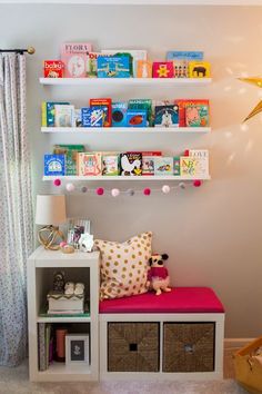 there is a shelf with books and toys on it