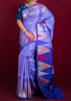 Introducing the Exclusive Mahapar Crowned Border Gadwal Silk Saree in Medium Purple, Royal Blue, Golden and Multicolored Weave. Elevate your wardrobe with this luxurious and one-of-a-kind saree, featuring a stunning temple border design and a blend of rich colors. Make a statement wherever you go with this elegant piece. Pure Silk Saree Jogulamba Gadwal Weaving Cluster Woven Kaduwa Work. Unstitched Matching Blouse Piece. Fabric Care: Please follow the fabric care instructions below carefully. Dry Clean Only. Avoid coming in contact with liquids, especially perfumes. Change fold regularly, and store in pure cotton fabrics. Iron on Reverse. Do Not Bleach And Expose This Product To Excessive Heat And Sunlight For Long. Work Disclaimer: Blouses/Jewelry worn by the model are only for photo shoo Batik Print Dress, Lehenga Jewellery, Saree Sale, Dresses Traditional, Lehenga Style, Lawn Dress, Jamdani Saree, Pure Silk Saree, Hand Woven Textiles