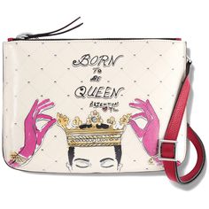 a white purse with pink handles and an image of a woman's face on it