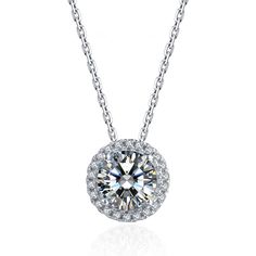 With a round moissanite at the core and a halo encircling it, this moissanite pendant necklace is a glittering marvel. It gives off the illusion of a sparkling star and looks extravagantly elegant. Features Moissanite was originally found in meteorites(Chemical name: Silicon Carbide). It was first discovered in 1893, while a scientist was examining meteor samples from a crater in Arizona. After many years, the experts has been recreated moissanite in the laboratory, that make the gemstone with f Moissanite Necklace With Halo Design In Diamond White, Dazzling Moissanite Round Pendant Necklace, Moissanite Round Pendant Necklace, Moissanite Round Pendant Necklace With Halo Setting, Moissanite Pendant Necklace With Halo Setting, Dazzling Round Pendant Moissanite Necklace, Dazzling Solitaire Necklace With Halo Setting, Dazzling Solitaire Necklace With Round Pendant And Halo Setting, Moissanite Necklace With Round Pendant And Halo Design