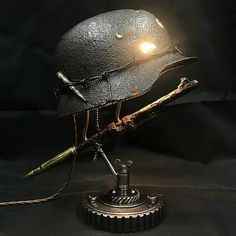 a metal helmet with a light on top of it