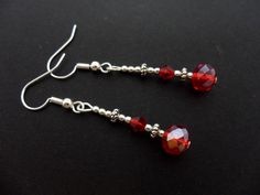 This a pair of pretty little silver plated red crystal bead dangly earrings. Measure approx. 4cm from top of hook to bottom of earring. These earrings are for pierced ears. Freshly made by me and unworn. Thanks for looking!! Red Crystal Drop Earrings, Red Crystal Dangle Jewelry, Red Sterling Silver Beaded Earrings, Handmade Red Crystal Drop Earrings, Red Crystal Round Earrings, Silver Crystal Beaded Earrings For Gift, Red Sterling Silver Beaded Earrings Gift, Red Sterling Silver Drop Crystal Earrings, Red Sterling Silver Crystal Drop Earrings