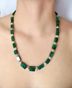 Unique beaded necklace in a beautiful green shade, handmade with natural Malachite cube beads, combined with alternating 925 Sterling Silver faceted beads.  Beads graduate in size from 8.5 mm to 5 mm.925 Sterling Silver clasp.Length 55 cm (21.6 in)All items are delivered ready for gift-giving. Please don’t hesitate to contact me if you have any questions regarding this item. I’ll be happy to assist you.Thank you for visiting my shop. View additional designs herehttps://www.etsy.com/shop/Chrissil Rectangular Green Beaded Necklace For Gift, Green Rectangular Beaded Necklace Gift, Handmade Green Rectangular Necklace, Adjustable Beaded Malachite Necklaces, Handmade Square Green Jewelry, Green Beaded Rectangular Necklace, Green Rectangular Beaded Necklace, Green Malachite Beaded Necklaces With Natural Stones, Elegant Beaded Malachite Necklaces