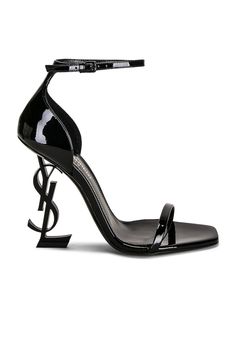 Find SAINT LAURENT Opyum 110 Ysl Heeled Sandals In Black on Editorialist. Saint Laurent Opyum 110 YSL Heeled Sandals in Black Patent leather lambskin upper with leather sole. Made in Italy. Ankle strap with buckle closure. Metal YSL initial sculptural heel. Open square toe. Approx 110mm/ 4.3 inch heel. SLAU-WZ964. 557662-0NPVV-1000. About the designer: SAINT LAURENT has been influencing and revolutionizing the fashion industry since the debut of its iconic ‘Rive Gauche’ collection in 1966 - the couture house was the first to create a ready-to-wear capsule. The sleek, precisely tailored staples, like the signature biker jackets, transcend seasons and trends. Creative Director Anthony Vaccarello continues to honor the label’s illustrious reputation by reintroducing cult styles, including the School Baddie, Ysl Handbags, Baby Wardrobe, Heels Aesthetic, Ysl Heels, Crystal Sandals, Biker Jackets, Black Sandals Heels, Rive Gauche