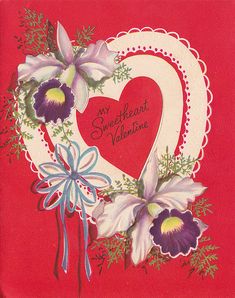 a valentine's day card with flowers and a heart