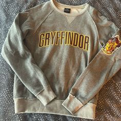 Universal Studios Wizarding World Of Harry Potter Gryffindor Sweatshirt Size Small. Never Worn! Gryffindor Sweatshirt, Gryffindor Logo, Gryffindor House Crest, Shifting Closet, Logo House, Gryffindor House, Harry Potter House, Dr Wardrobe, Harry Potter Houses