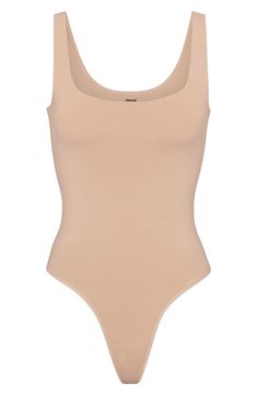 This scoop-neck bodysuit is the perfect everyday essential for light smoothing and support for your waist. It features a double scoop neck and a thong back that make it seamless under clothing. Pull-on style (no snap closure) Scoop neck Thong back Cotton-lined gusset 85% nylon, 15% elastane Hand wash, line dry Imported Seamless Soft Stretch Bodysuit, Smoothing Scoop Neck Shapewear Bodysuit, Stretch Smoothing Bodysuit With Scoop Neck, Seamless High Stretch Bodysuit With Scoop Back, Stretch Scoop Neck Smoothing Bodysuit, Stretch Smoothing Scoop Neck Bodysuit, Seamless Low Back Bodysuit With Minimal Stretch, Scoop Neck Shapewear Bodysuit With Lined Body, Scoop Neck Lined Body Shapewear Bodysuit