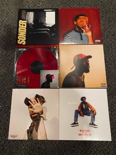 four different album covers sitting on top of each other in front of a carpeted floor