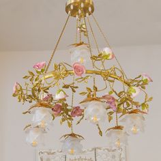 a chandelier with flowers hanging from it