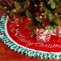 a christmas tree skirt with presents under it