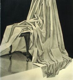 a black and white photo of a woman sitting on a chair looking at the curtain