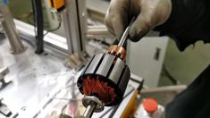 a person working on an object in a machine shop